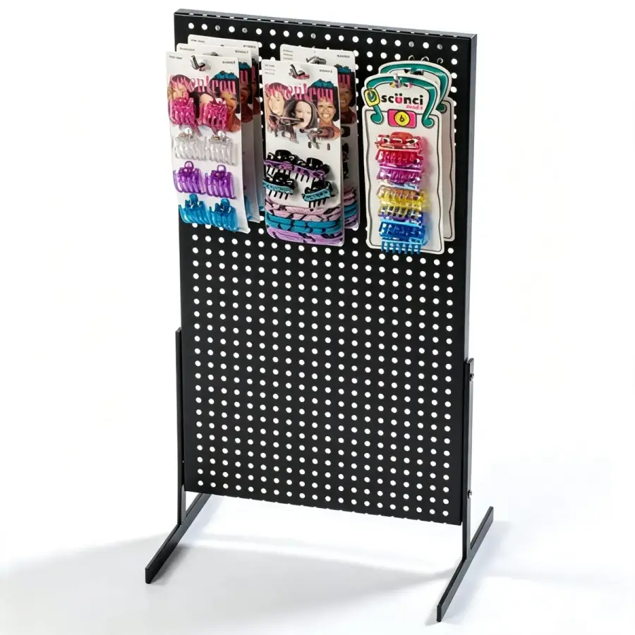 Freestanding double-sided black pegboard display stand with Scunci hair clip cards hung on metal hooks